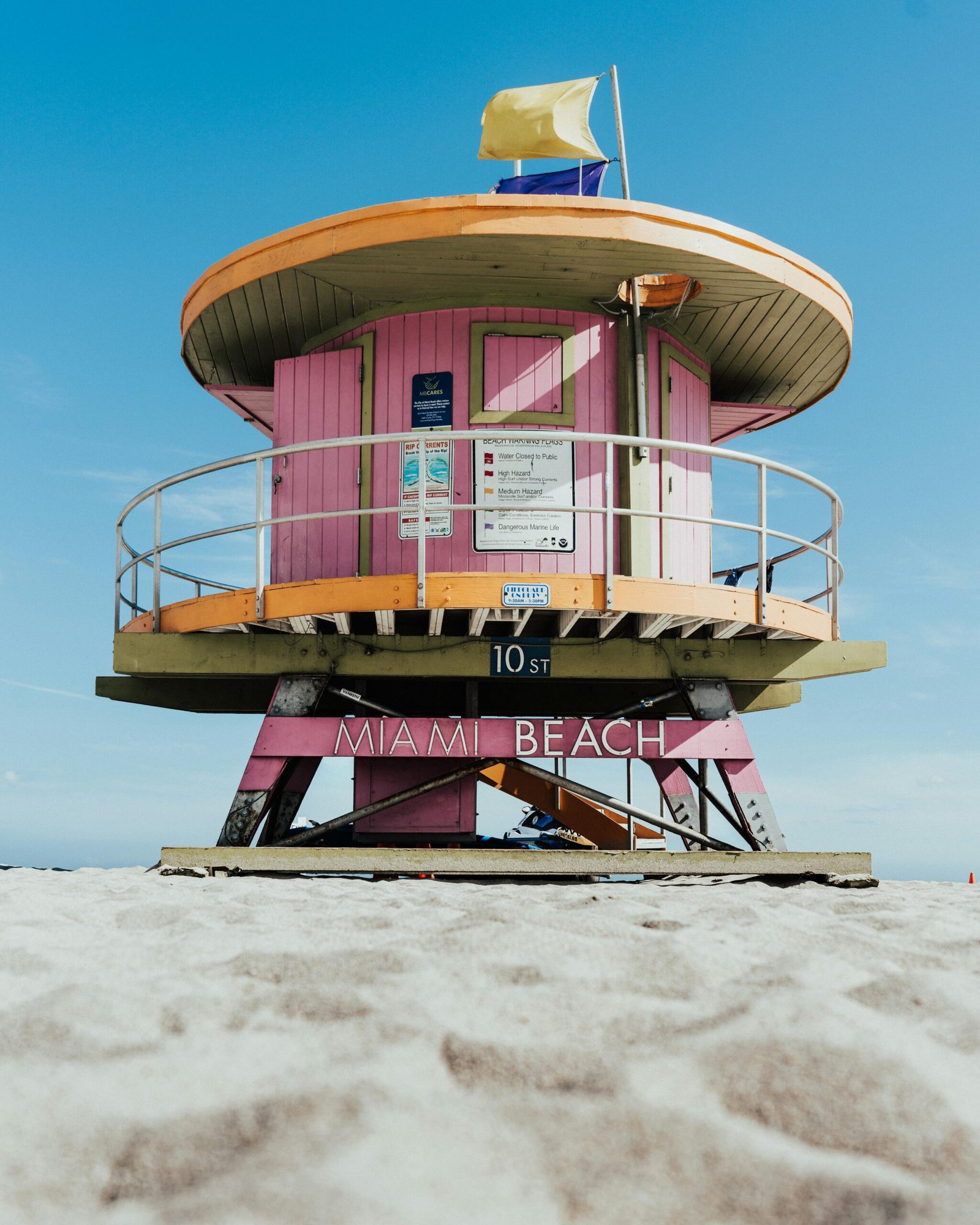 Bright pink lifeguard tower on a sunny day at Miami Beach.